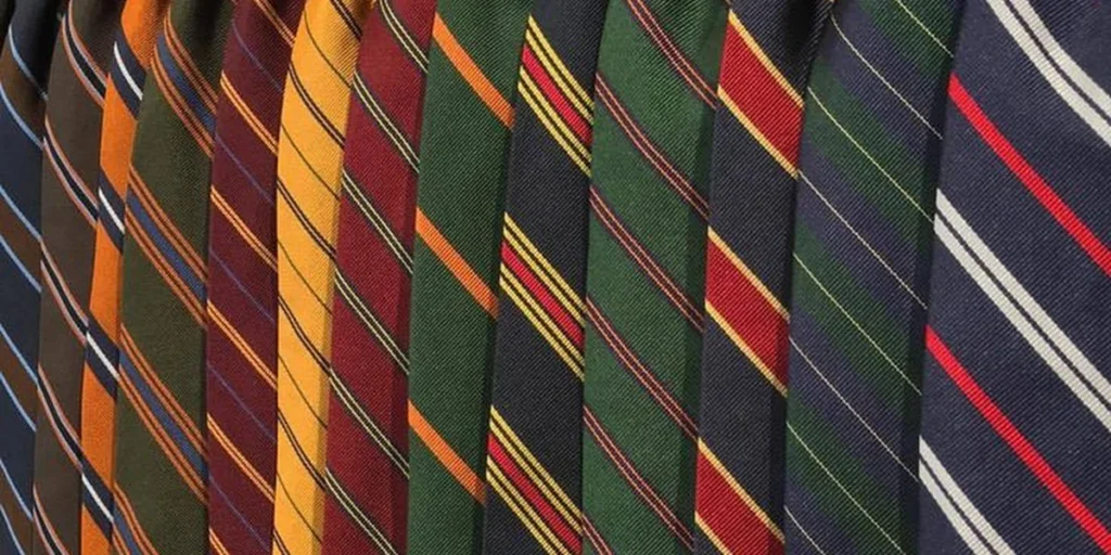 Repp silk history thumbnail — diagonal stripes in multiple colors gathered together, showing the ribbed repp weave that defines the category