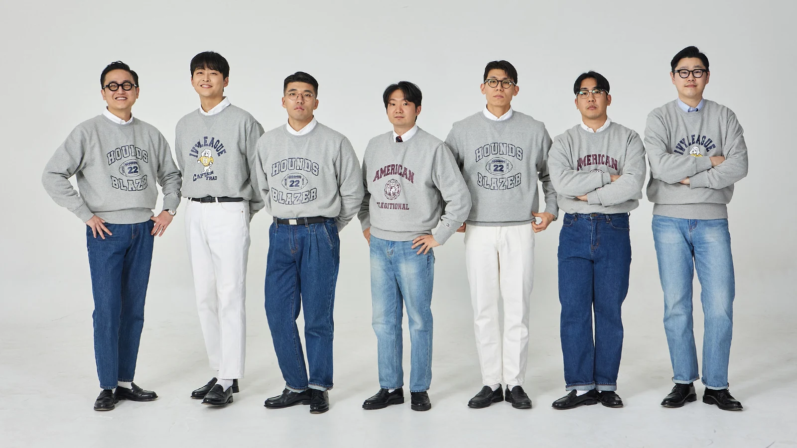 trad denim full color spectrum: Renacts team in row showing seven denim colorways from indigo to cream side by side, all in collegiate grey sweatshirts