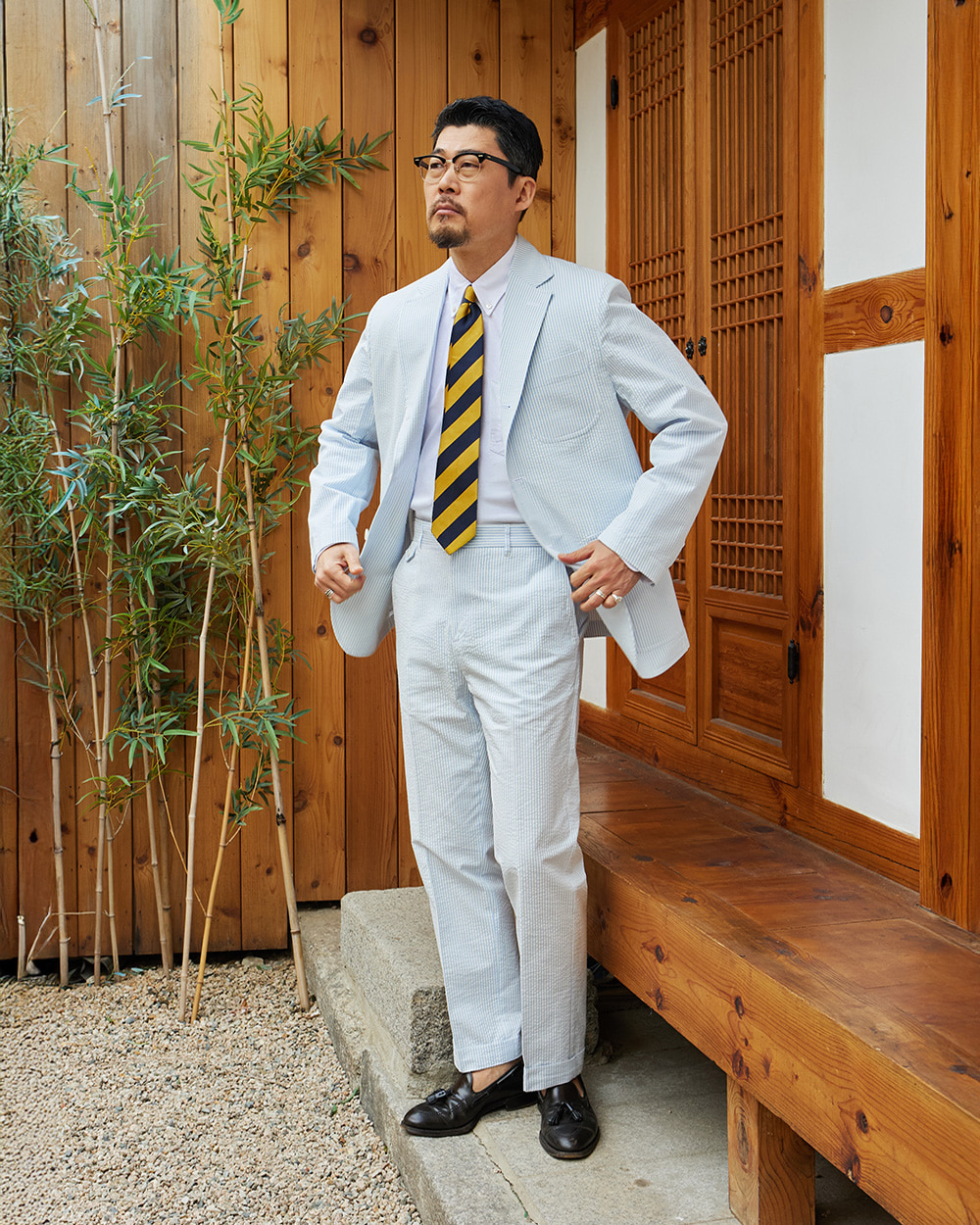 Navy and gold repp stripe tie with a button-down collar and seersucker suit — american ivy repp tie