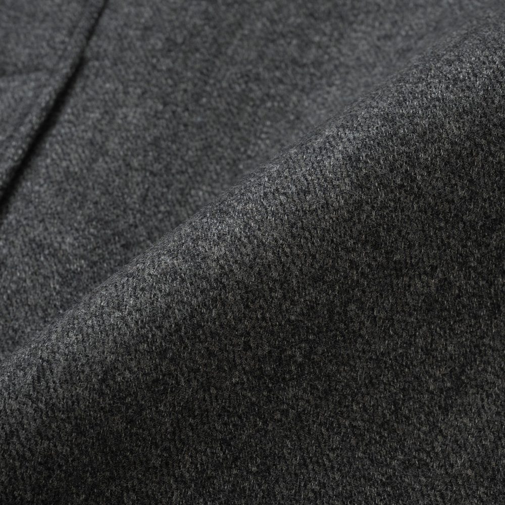 Close-up of herringbone wool cloth on a balmacaan coat