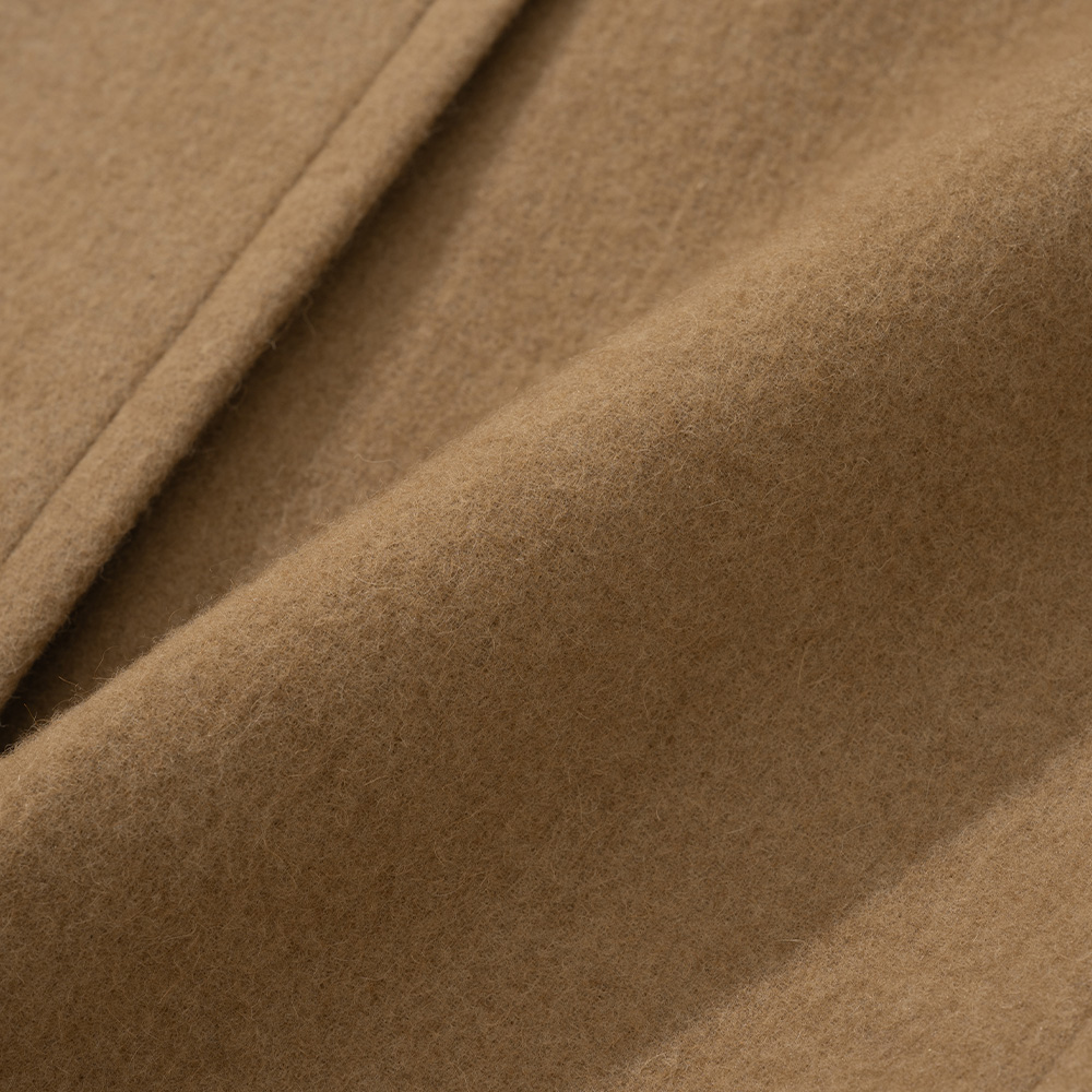 Close-up of 22oz camel and wool cloth on a polo coat