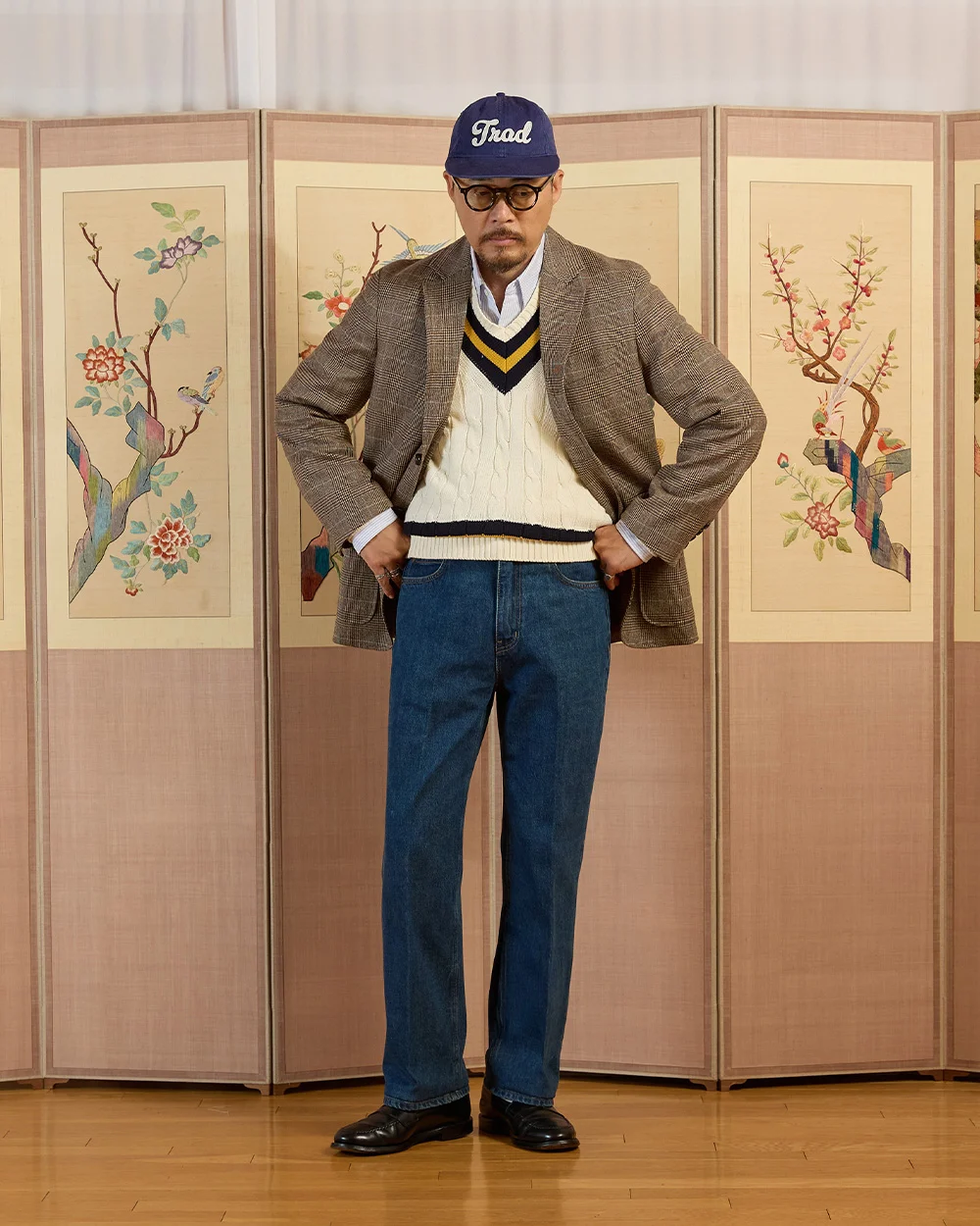 Glen check tweed blazer over a cream cricket sweater, navy Trad cap, jeans and black loafers — Renacts FW25 lookbook, Seoul