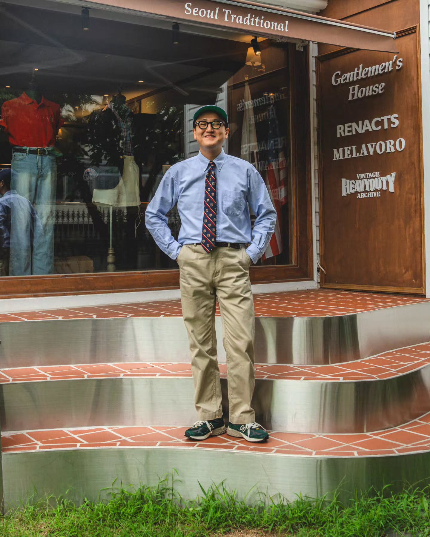 light blue OCBD tucked into khaki chinos with a belt, outside the Yeonhui-dong showroom