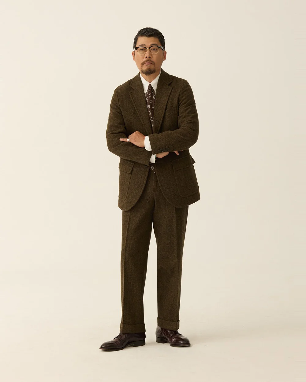 Outfit E: N-Herringbone Sack Cut Blazer and Pipe Stem Trouser in Olive Brown as a suit, white OCBD, dark foulard tie, burgundy loafers — Renacts FW26 lookbook (new, in stock)
