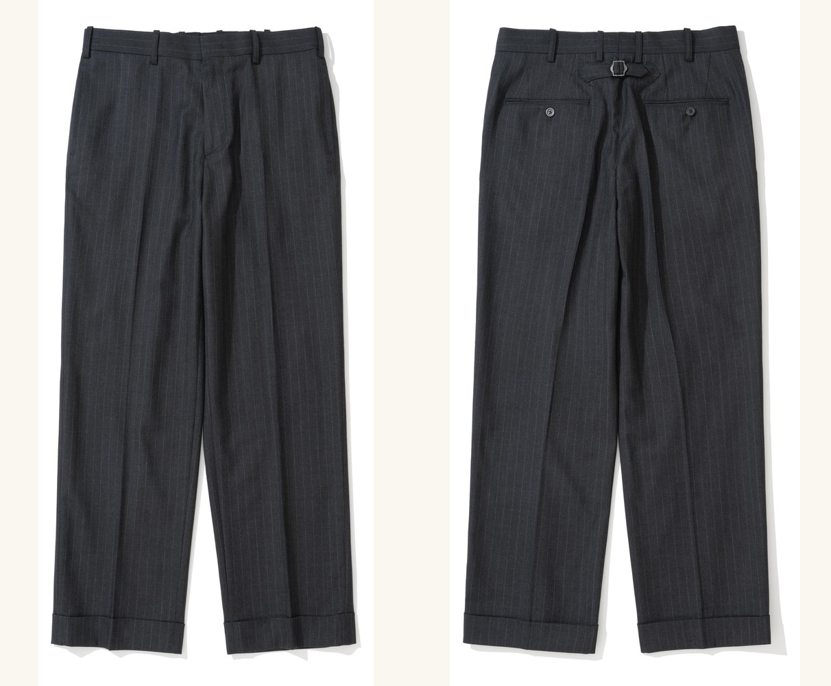 Charcoal pinstripe pipe-stem trousers laid flat, front and back side by side: a flat front with turn-up cuffs, and a back with a cinch-back buckle above two buttoned welt pockets