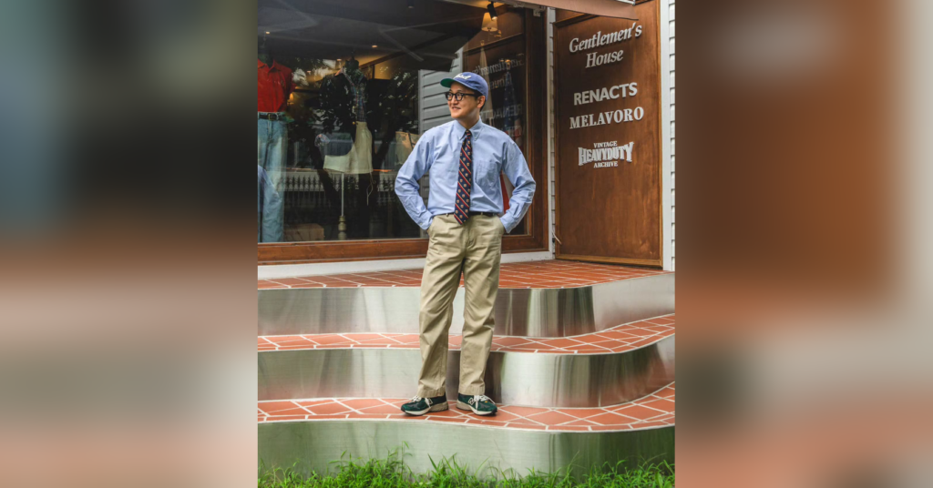 Blue shirt and patterned tie with khaki chinos and green sneakers outside Gentlemens House in Seoul, original photograph centered with blurred side padding.
