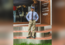 Blue shirt and patterned tie with khaki chinos and green sneakers outside Gentlemens House in Seoul, original photograph centered with blurred side padding.