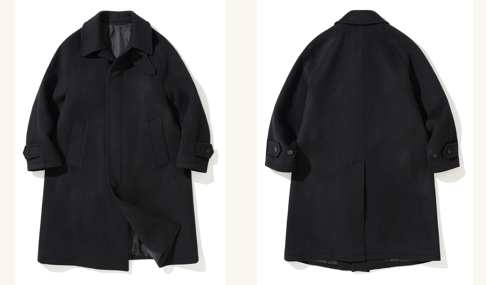 Black brushed wool balmacaan coat laid flat, front and back side by side, with raglan sleeves, a fly front and slanted pockets