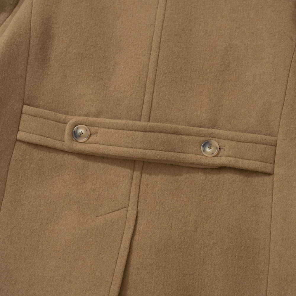 Half belt with two horn buttons across the back of a camel polo coat